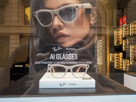  Ray Ban Meta smart glasses showcasing technological innovation, positioned on retail display near large promotional poster with model. Pic credit: Columbo.photog/ Shutterstock 